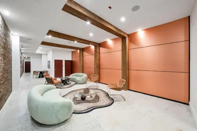 a lobby with a couch and chairs and a table at Landmarked NYC Townhome - Sleeps 10 -Group-Friendly in New York