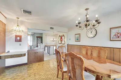 a dining room and kitchen with a table and chairs at Watertown Home with Yard 1 Mi to Echo Lake Park! in Watertown