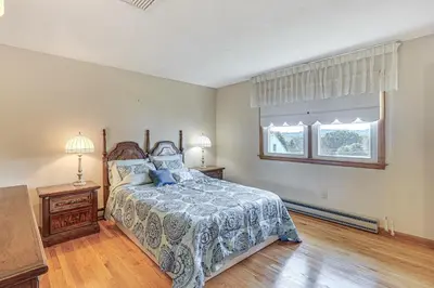a bedroom with a bed and a window at Watertown Home with Yard 1 Mi to Echo Lake Park! in Watertown