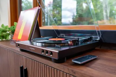 a record player sitting on top of a counter at Luxury Chalet, Firepit, Sauna, Pet Friendly, 5 mins to Windham Mtn resort in Windham