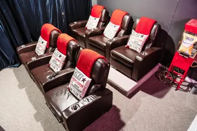 a group of chairs in a room with christmas pillows at Hunter Haven - Luxury Cabin Near Mountain Ski Resort in Lanesville