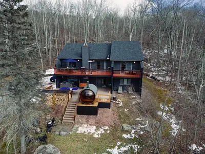 an aerial view of a house in the woods at Hunter Haven - Luxury Cabin Near Mountain Ski Resort in Lanesville
