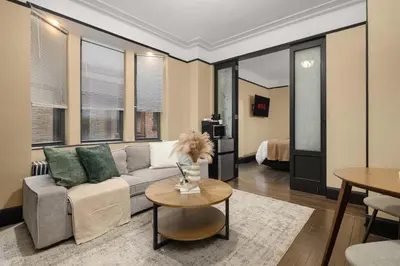 a living room with a couch and a table at Stunning Apt in The Heart of New York City GYM in New York