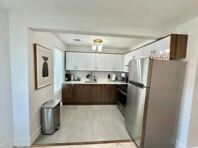 a kitchen with a stainless steel refrigerator at Comfy NJ 2BR Close to Airport, Dream Mall & NYC in East Newark