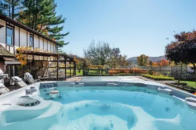 a large swimming pool in the backyard of a house at ABC Stay - Connecticut Five Bedroom Home in Warren