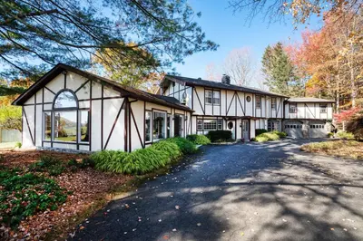 a large white house with a driveway at ABC Stay - Connecticut Five Bedroom Home in Warren