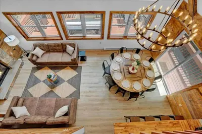 an overhead view of a living room with a table at Chalet Lake, Movie Theater, Hot Tub, Arcade in Gouldsboro