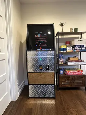 a refrigerator with a game system in a room at Family Lake House Waterfront in Saugerties