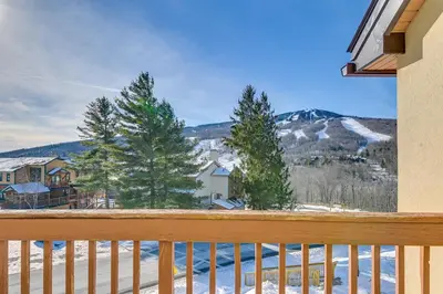 a view from the balcony of a house with snow at Bearfoot Apres Mtn-View Condo Less Than 1 Mi to Mt Snow! in Podunk