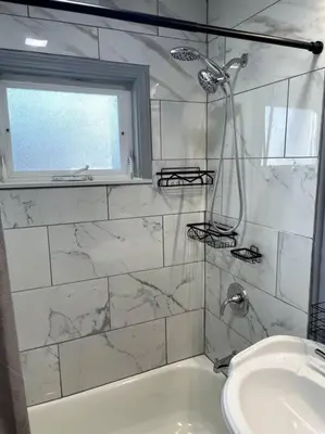 a white bathroom with a sink and a shower at New Quaint & Convenient Hideaway Great Location in East Hartford
