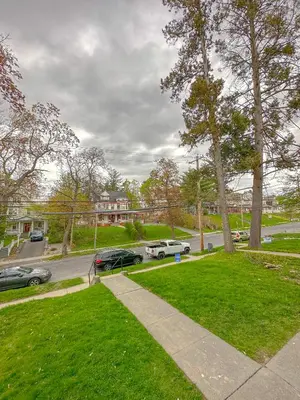 a park with cars parked in a parking lot at The Allen House - 3 Bedroom - 2 Full Bath - Private Gorgeous Apartment - Sleeps 8 in Albany
