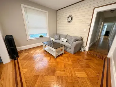 a living room with a couch and a table at The Allen House - 3 Bedroom - 2 Full Bath - Private Gorgeous Apartment - Sleeps 8 in Albany