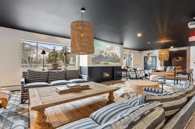 a living room with couches and a fireplace at Inn At Mount Snow in West Dover