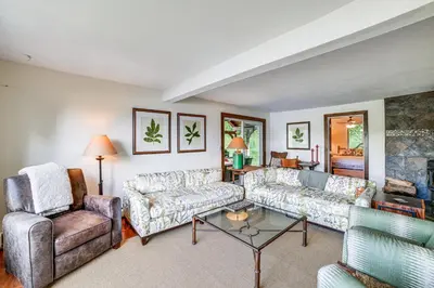 a living room with two couches and a fireplace at Home with Private Dock Near Colgate University in Hamilton