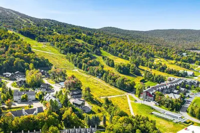 an aerial view of a town in the mountains at Walk to Ski Lift Spacious Condo in West Dover! in West Dover