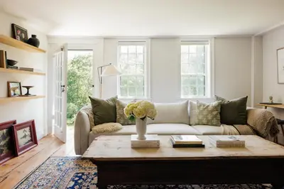a living room with a couch and a coffee table at Stylish Rural Sanctuary Perfect for Every Season! in East Chatham