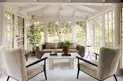 a living room with a couch and a table and chairs at Stylish Rural Sanctuary Perfect for Every Season! in East Chatham