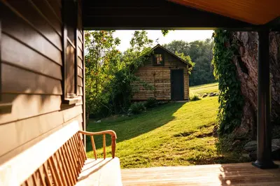 an open door of a house with a small building at Stylish Rural Sanctuary Perfect for Every Season! in East Chatham