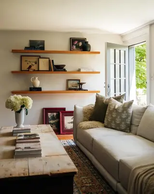 a living room with a couch and a coffee table at Stylish Rural Sanctuary Perfect for Every Season! in East Chatham