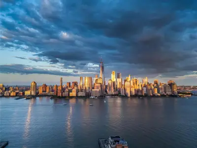a view of a city from the water at The Othello - Luxury Industrial Loft near NYC in Communipaw
