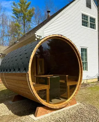 a large wooden barrel sitting in front of a house at Relaxing Hudson Valley Getaway- 4BR Sauna 15 acres in Stone Ridge