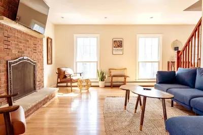 a living room with a couch and a fireplace at Relaxing Hudson Valley Getaway- 4BR Sauna 15 acres in Stone Ridge