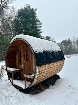 a small wooden cabin with snow on top of it at Relaxing Hudson Valley Getaway- 4BR Sauna 15 acres in Stone Ridge