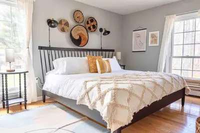 a bedroom with a bed with hats on the wall at Relaxing Hudson Valley Getaway- 4BR Sauna 15 acres in Stone Ridge