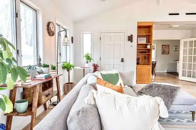 a living room with a couch and a table at Relaxing Hudson Valley Getaway- 4BR Sauna 15 acres in Stone Ridge