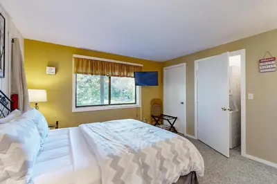 a bedroom with a large bed and a window at Dover Green 15F in Dover