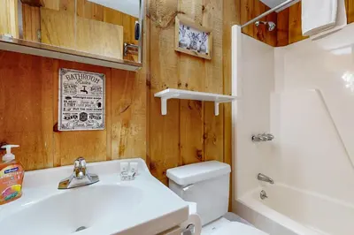 a bathroom with a sink and a toilet and a tub at Dover Green 15F in Dover