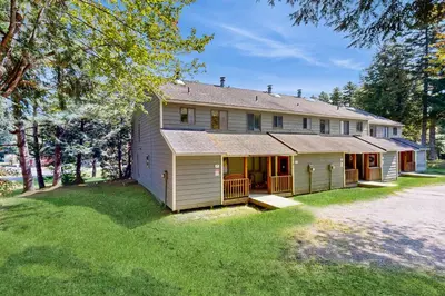 a house with a large yard in front of it at Dover Green 15F in Dover