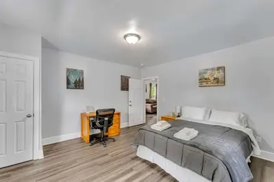 a bedroom with a bed and a desk in it at Pitcher's Paradise Apt 1-All Star Baseball Rentals in Oneonta
