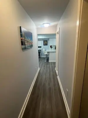 an empty hallway of a apartment with a kitchen and a hallway at Charming Unit in Yonkers Close to NYC in Yonkers