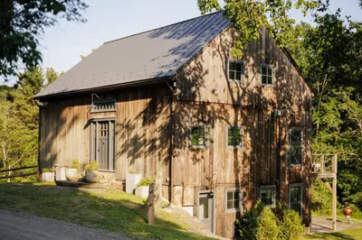 an old barn with a metal roof at Stunning All-Season Renovated Barn Escape! in East Chatham