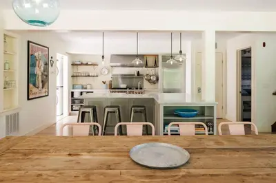 a kitchen and dining room with a table and chairs at Stunning All-Season Renovated Barn Escape! in East Chatham