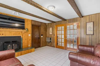 a living room with a couch and a fireplace at 3BR Gem, 10 min to Yale, walk to Tweed in New Haven
