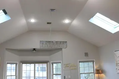 a ceiling with a chandelier in a room with windows at Modern minimalistic 3 bdr Apt Townhouse in Jersey City