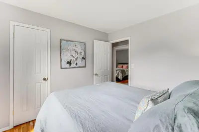a white bedroom with a bed and a closet at Family Home Close to Warwick, 5 Mi to Lake! in Monroe
