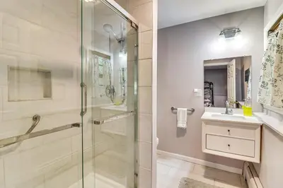 a bathroom with a glass shower and a sink at Family Home Close to Warwick, 5 Mi to Lake! in Monroe