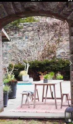 a picnic table with chairs and potted plants at Midcentury Modern ZenHouse Sculptor Studio in Stamford