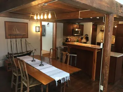 a kitchen with a wooden table with a boat on it at Stratton Chalet in Stratton