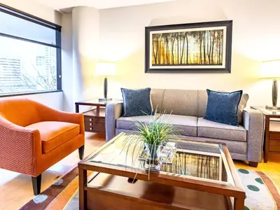a living room with a couch and a coffee table at Centrally Located Apt Downtown in Stamford