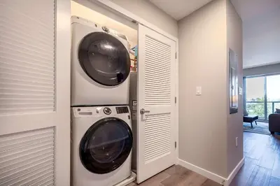 a laundry room with a washer and dryer at Modern Apt with Luxury Amenities in Stamford