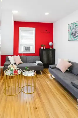 a living room with a couch and two tables at Harty's Terrace 9 Kimball Avenue in Yonkers