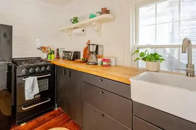 a kitchen with a stove and a sink at 1BR Hudson Apartment 3Min Walk To Warren St For Two in Hudson