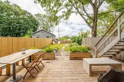 a patio with a table and chairs and a fence at 1BR Hudson Apartment 3Min Walk To Warren St For Two in Hudson