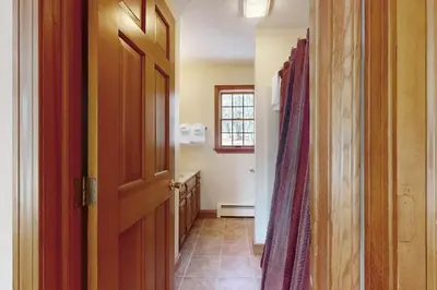a hallway with an open door to a room at Green Mountain Sunrise in Dover