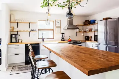 a kitchen with a large wooden counter top at Eldred Manor in Eldred