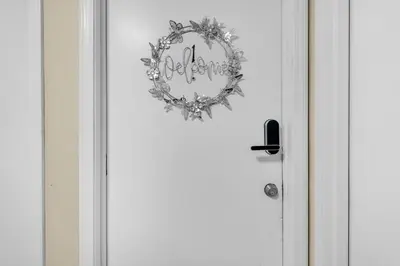a door with a wreath on the front of it at Crested One Place in Manchester